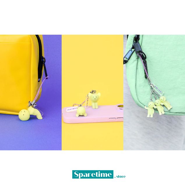 Four colorful phone cases with small yellow creature charms on a multicolored background, featuring the brand 'Spacetime'.