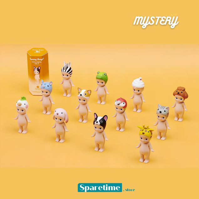 A collection of small blind-box character figurines and their packaging on a warm yellow background. The set includes multiple mini-dolls with different animal and character designs, along with a yellow box labeled 'Mystery'.