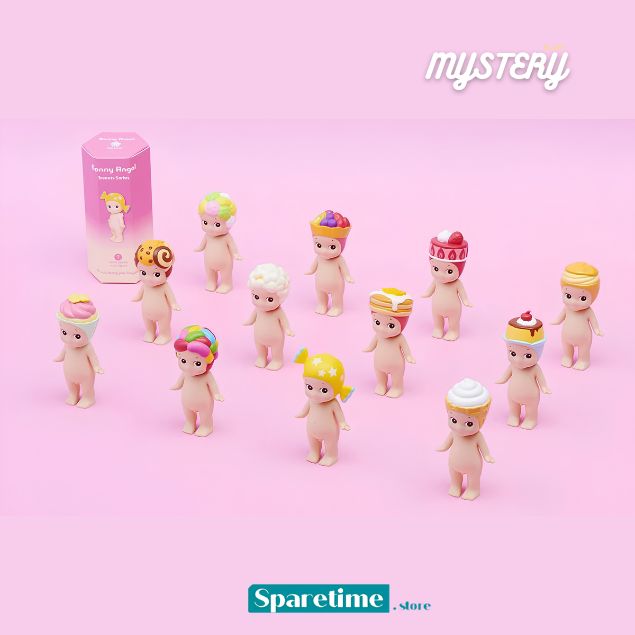 A set of small pastel-colored toy figures arranged on a pink background, with one pink box visible behind them. The figures have pale skin tones and colorful whimsical hats or headpieces.